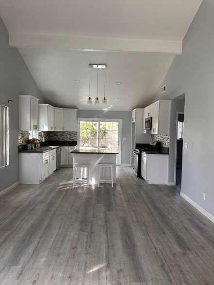 open concept living room / kitchen - 19729 Normandale Ave