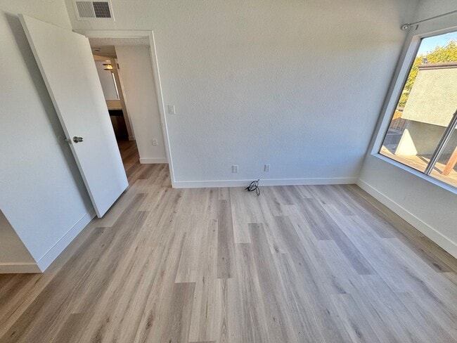 Building Photo - BRIGHT 2-BEDROOM CONDO NEAR STRIP & UNLV W/ PRIVATE BALCONY