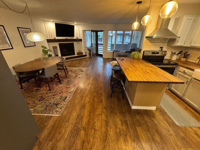 Building Photo - Bright 2BR Townhome with 3 Balconies & Private Patio