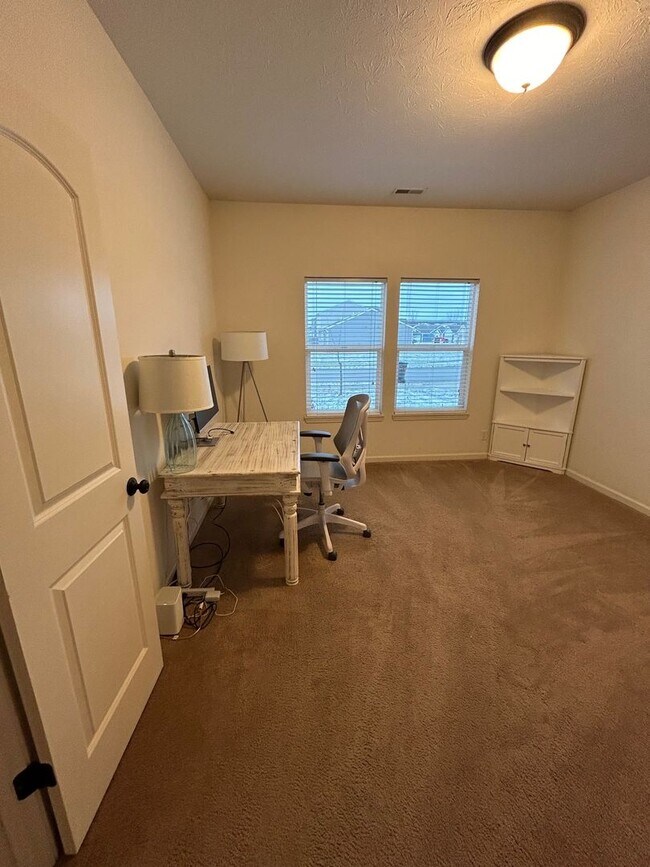 Building Photo - House with Fenced Backyard