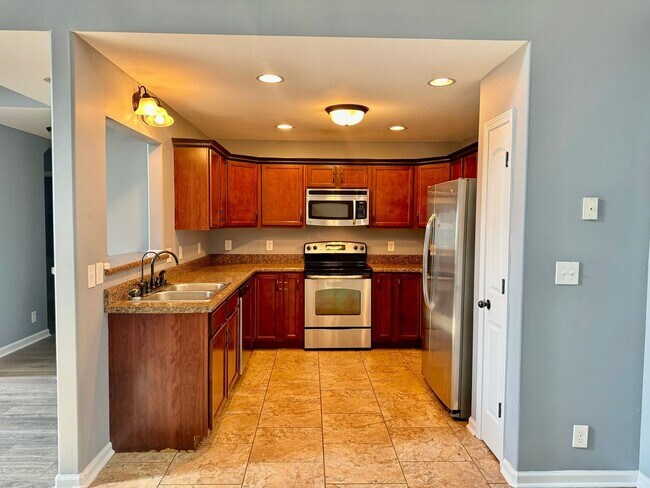 Building Photo - Large Open 4 Bedroom Home with Bonus! Tree Lined Backyard with Privacy Fence!