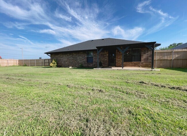 Building Photo - Fenced yard/Storage building/Close to college/Paved street