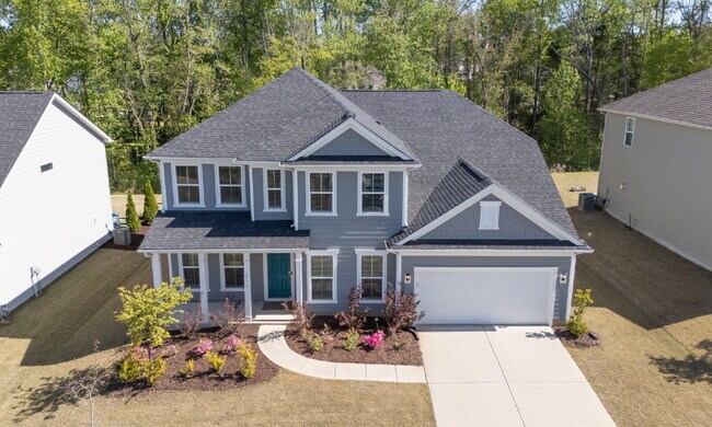 Building Photo - "Discover Spacious Living: 5-Bedroom Craftsman Home in Gated and Amenity-Rich Bretagne with Top-R...