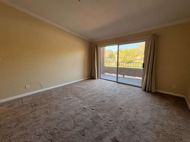 Building Photo - 1BR Condo with Private Balcony, Central A/C & Community Amenities in Corona