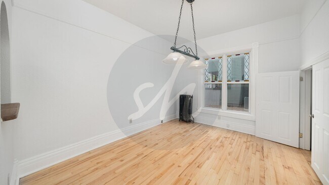 Building Photo - Updated 2-Bed Victorian Main-Floor Living with Stained Glass & Jetted Tub