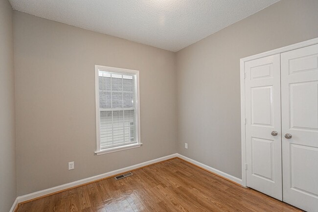 Building Photo - Like New Home off Freeman Mill.  Just Painted, New Wood/Vinyl Flooring, Vaulted Ceilings, Front P...