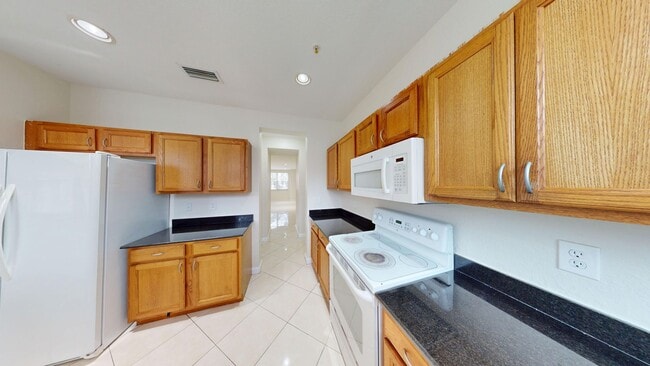 Building Photo - 4 Bed/3.5 Bath Townhome w/2 Car Garage in Pet Friendly Gated Community! ** Water/Cable/Internet I...