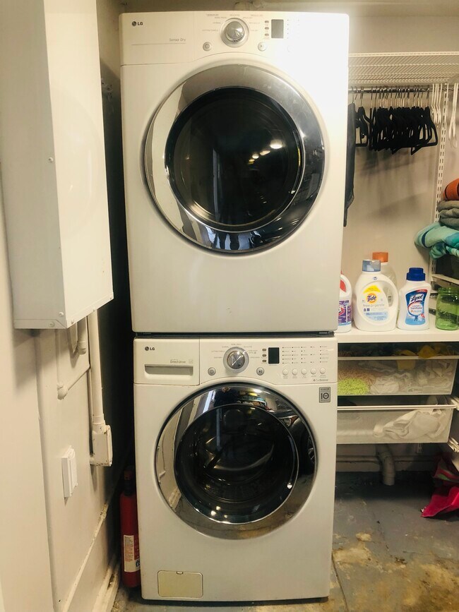 Private laundry in garage with folding/hanging area, storage - 232 Market St