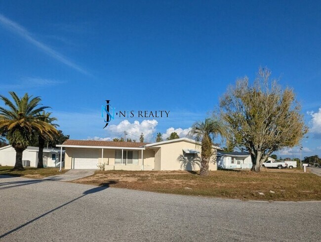 Building Photo - Just Reduced!  2/2/1 with  RENOVATED baths & kitchen, fenced yard, NEW lvp flooring and a OVERSIZ...