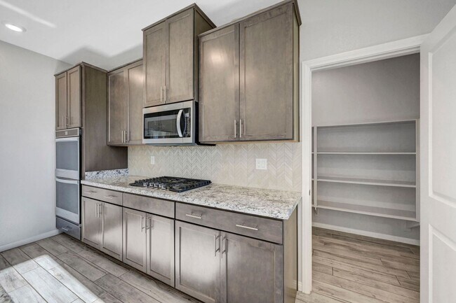 Building Photo - Gated community Located within the Valley Vista Master Plan. 4 Bed 3 Bath features and Open and i...