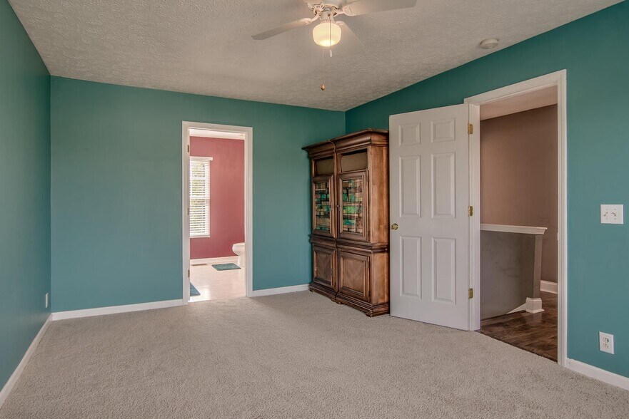 Master bedroom has been updated with Agreeable Gray paint color since this photo was taken. - 7109 Commonwealth Cir