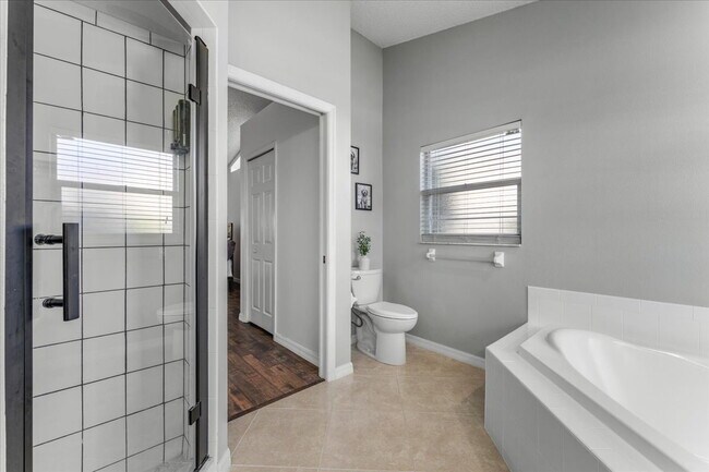 Building Photo - A vibrant 2-bedroom, 2-bathroom tropical retreat designed for both high-energy entertaining and l...