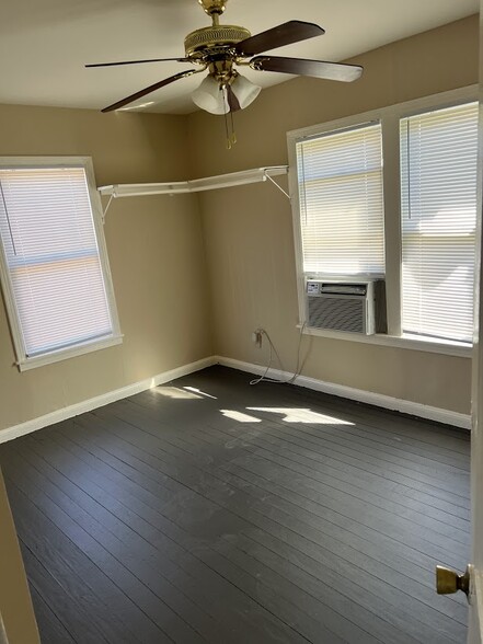 Bedroom, partial view. Fits a king-size bed. Has a closet too. - 1162 W 24th St