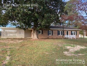 Building Photo - "Charming 3-Bed Retreat with Gleaming Hard...