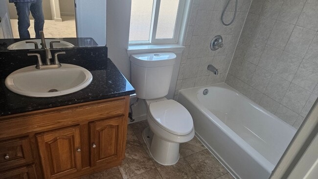Building Photo - Three Bedroom Two and a half bath house, 2 car garage, central air. Available now.