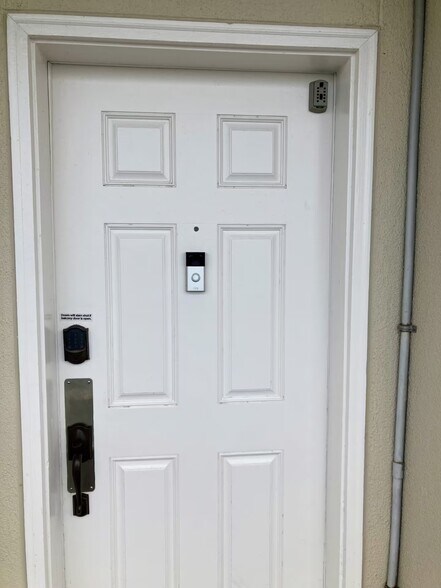 Ring doorbell on door for security - 9860 S Thomas Dr