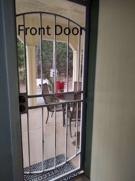 Main entrance showing Covered patio w table and chairs - 6588 Log Cabin Ln