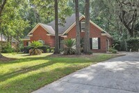 Building Photo - Stunning all-brick home on a large wooded lot