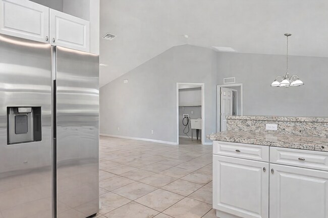 Building Photo - Spacious Three-Bedroom Home with Open Floor Plan, Large Yard & Screened Patio