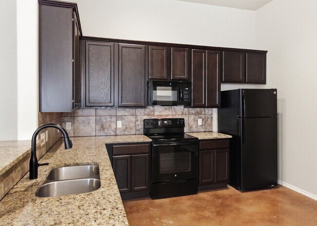 Building Photo - 3 Bedroom Duplex with Stained Concrete Floors and Greenbelt Views!