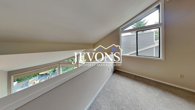 Building Photo - Top-floor 2-level condo with brand-new kitchen and ensuite bath – Utilities and internet included...