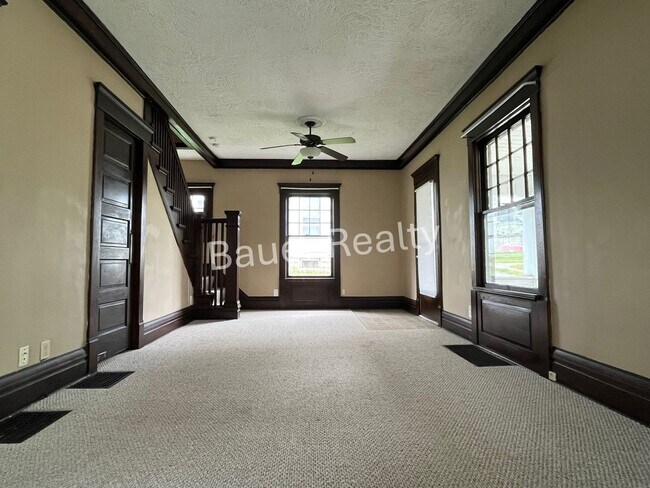 Building Photo - Three bedrooms, one and a half baths