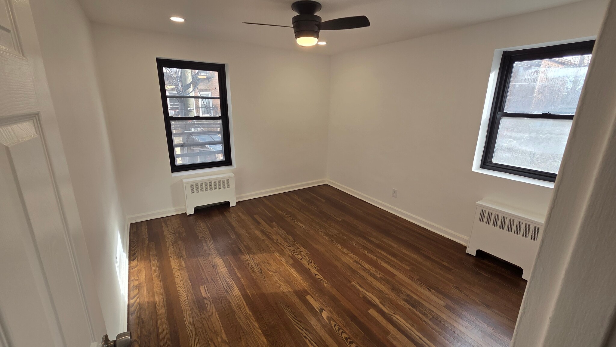 Bedroom with large closet and refinished hardwood floors - 165 Vroom St