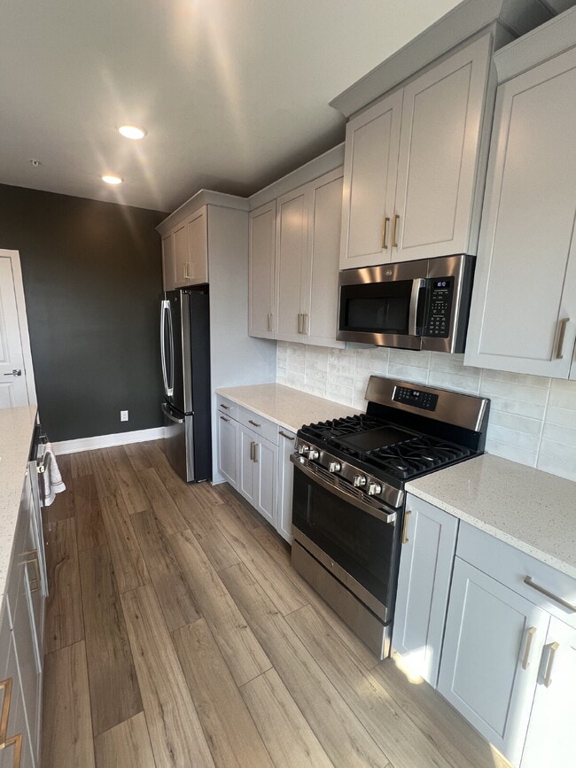 Building Photo - Brand-New Luxury 3BR Townhome-Style Condo ...