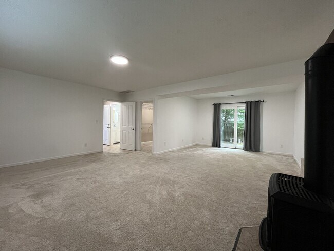 Building Photo - Three-Bedroom Home Near Nike Campus with Bonus Room, Large Deck & Two-Car Garage