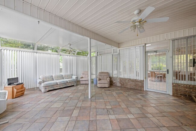 Building Photo - Spacious 3BR Retreat with Soaring Ceilings & Screened Porch