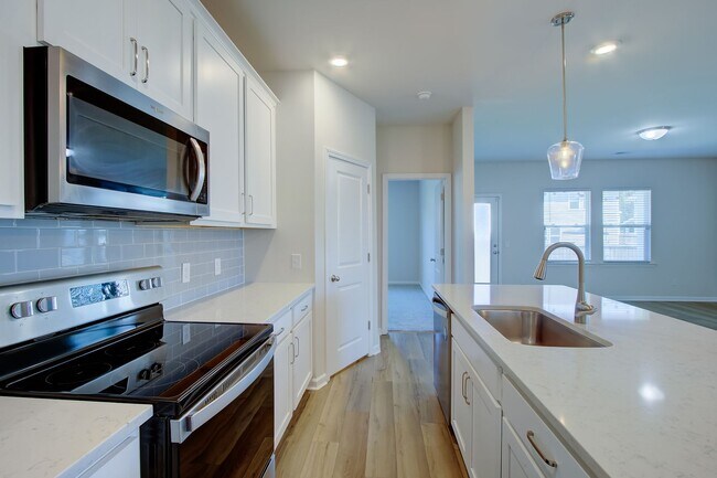 Building Photo - Spacious 4BR Rental with Stunning Kitchen & Covered Patio