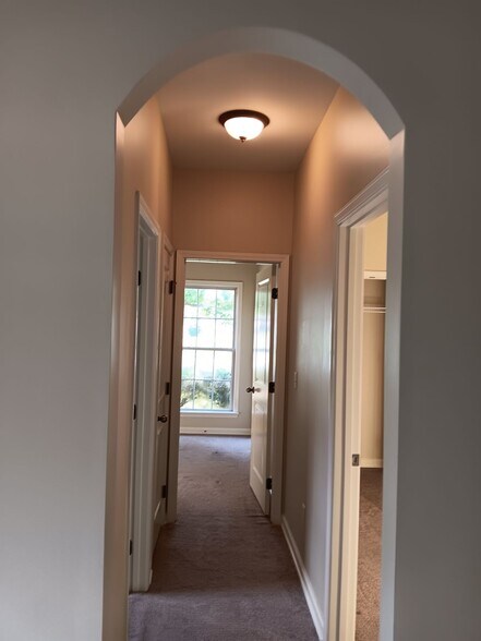 Hallway to bedrooms 2 & 3 and bathroom 2 - 1007 Meriweather Dr