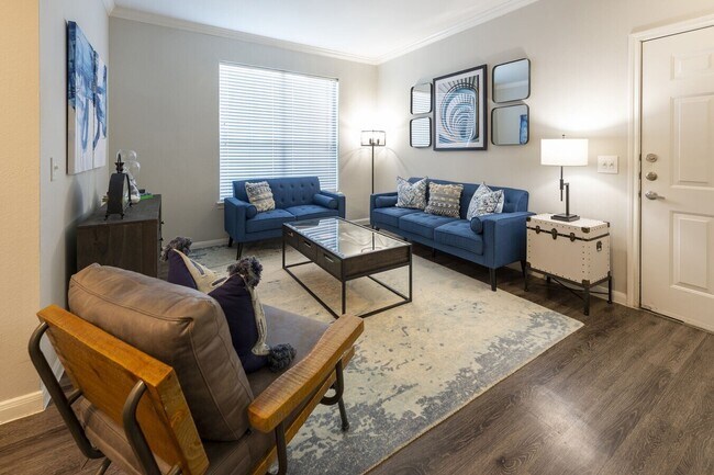 Building Photo - Live Large, Save Larger