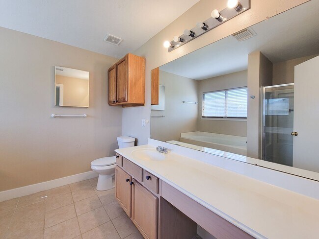 Building Photo - 3 bedroom one story home on large corner lot. Home has hard flooring throughout living areas and ...