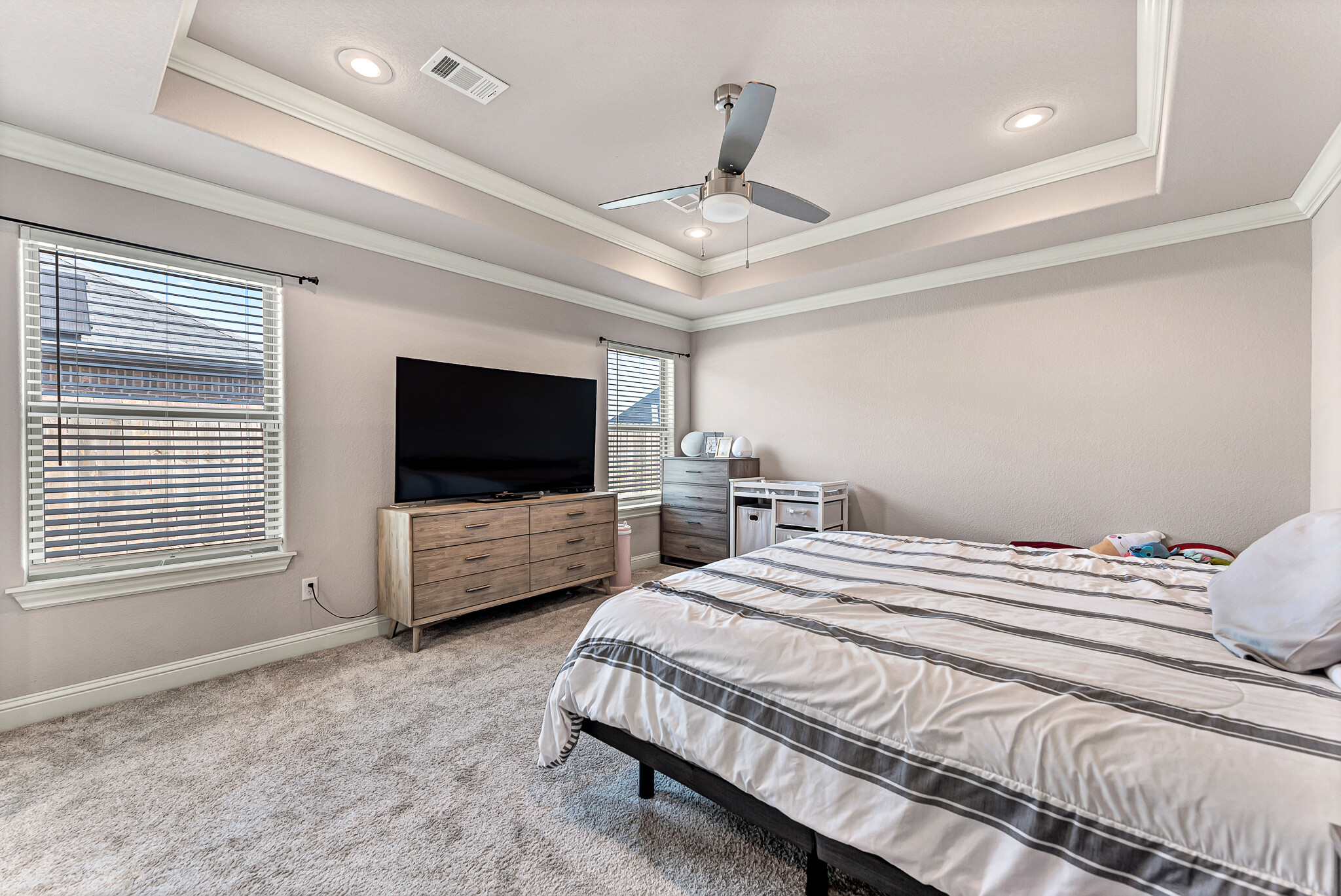 Large Primary Bedroom with tray ceiling. - 1871 Sunrise Cir