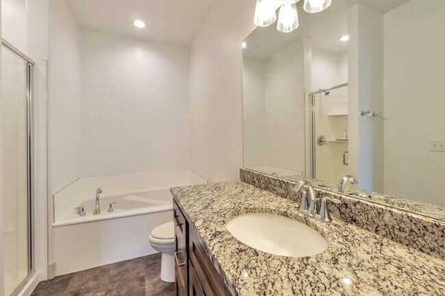Building Photo - Modern End Unit townhouse w attached 2 car...