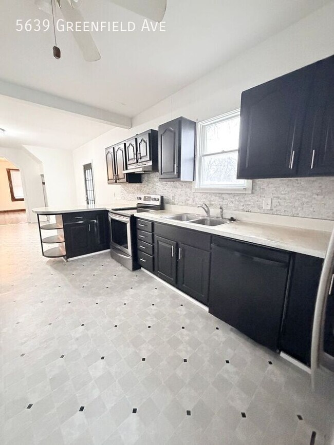 Building Photo - 5639 Greenfield Ave