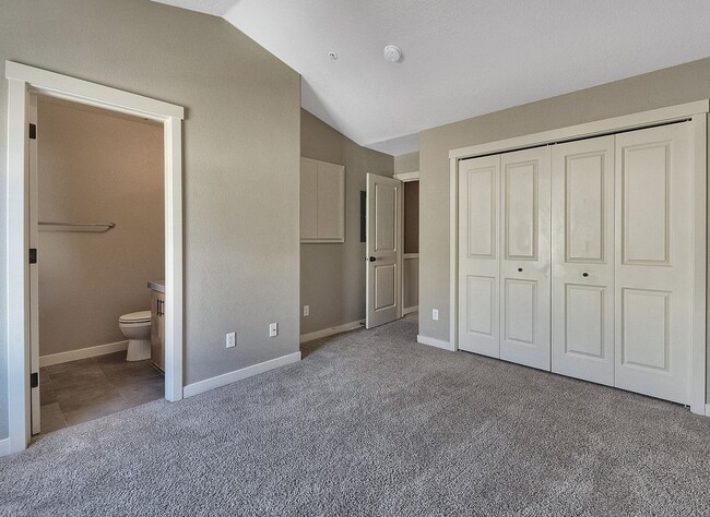 Building Photo - 2BR + 2.1BA Corner Townhome-Style Condo — Dual Primary Suites, Attached Garage & Most Utilities I...