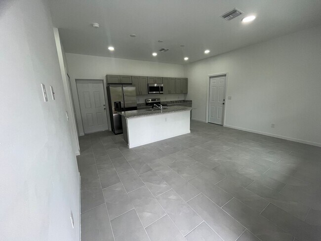 Building Photo - ONE OF A KIND! BRAND NEW 1 Bedroom-1 Bath- 1 Car Garage in Desirable Lehigh Acres!