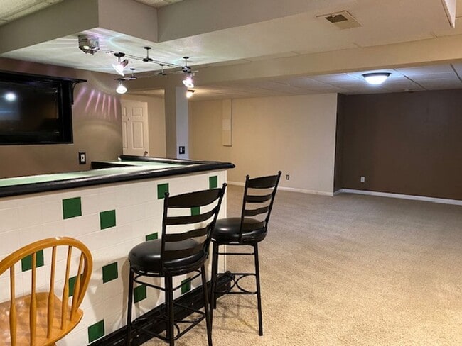 Building Photo - Three Bedroom Home w/ 2.5 Baths and 2 Car ...
