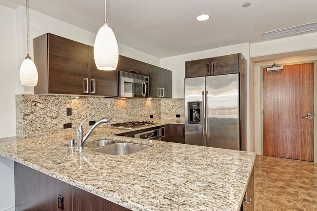 Building Photo - Modern Downtown Condo in Premier High-Rise...