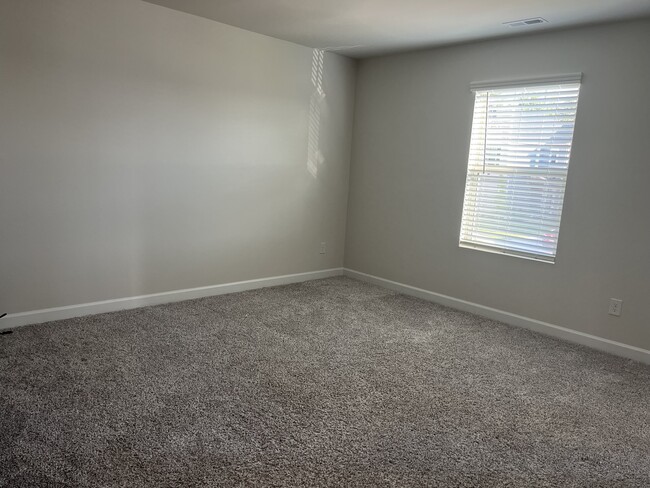 Upstairs bedroom 3, nice southern light and a walk-in closet. - 4111 Honey Locust Dr