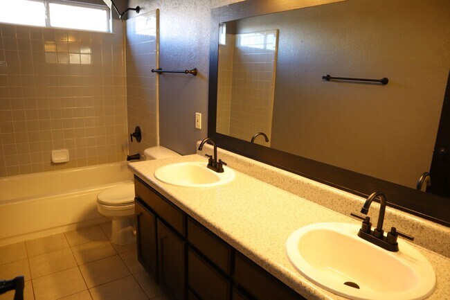 Building Photo - Home With A Pool and Much More!