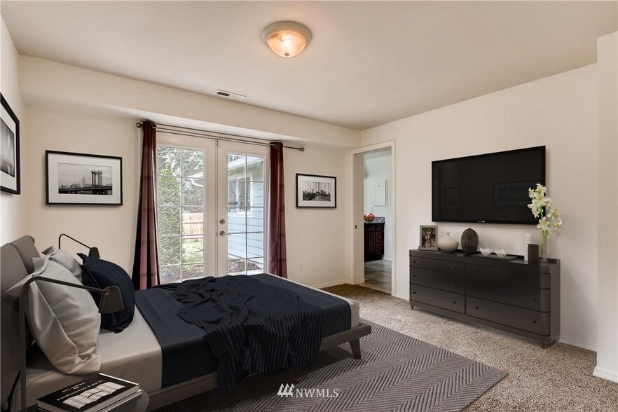 Large unfurnished, primary bedroom is 135 sq ft with private access to back patio and fenced yard - 245 S 126th St