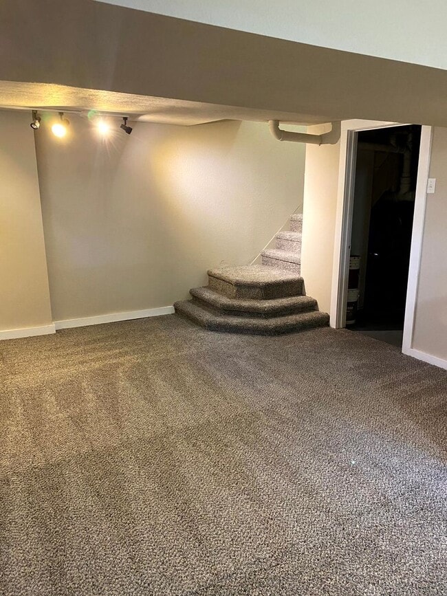 Building Photo - Located in Norwalk IA Updated 4 Bedroom 1 ...