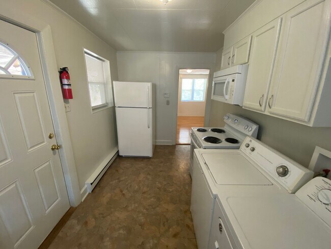 Building Photo - Private carport, in-unit laundry, and the Lakewood strip right outside your door.