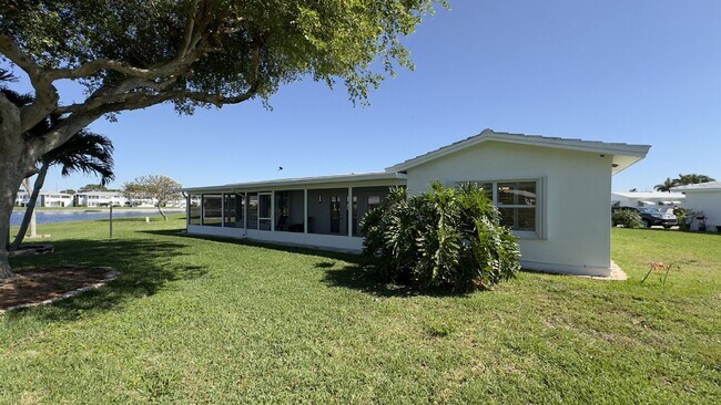 Building Photo - Lakefront 2BR Home in 55+ Leisureville Community