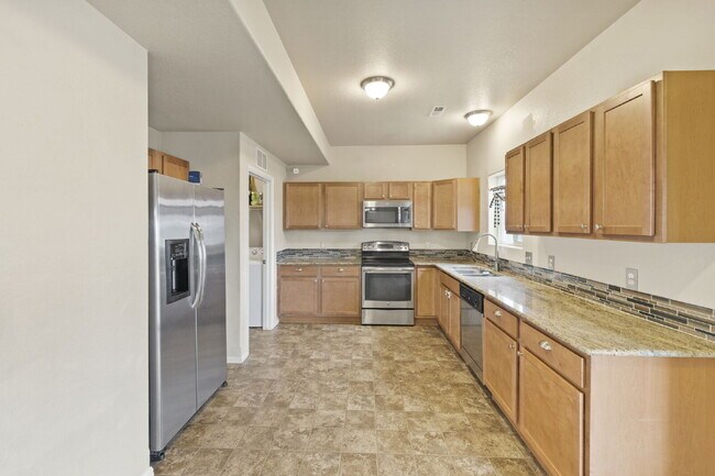 Building Photo - Spacious 4-Bedroom Home with Loft, Solar & Fenced Backyard