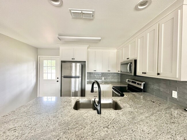 Building Photo - Pecan St. (LEASE UP ONLY)