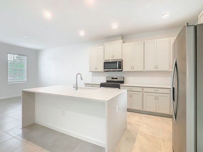 Building Photo - New Luxury Townhome in Celebration with All porcelain tiled floors. Island Village new construction